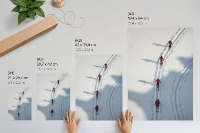 Decorative poster Skiers in the snow wearing red jackets