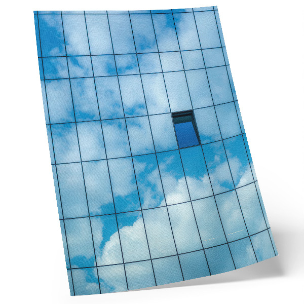 Poster A glass facade reflecting the sky and clouds