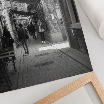 Premium wall art black and white narrow street with urban brick facades