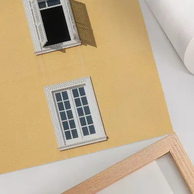 Art print featuring a yellow facade with three symmetrical windows in a simple style