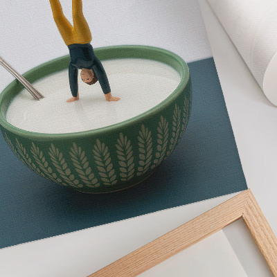 Poster Figurine in a bowl of milk with green leaves