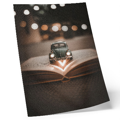 Art print Miniature car on a book with magic lights