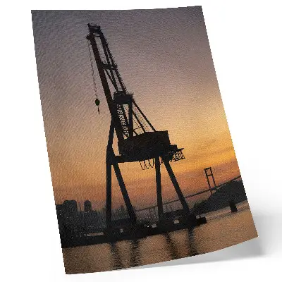 Premium decorative wall art industrial crane silhouette at sunset on a bridge