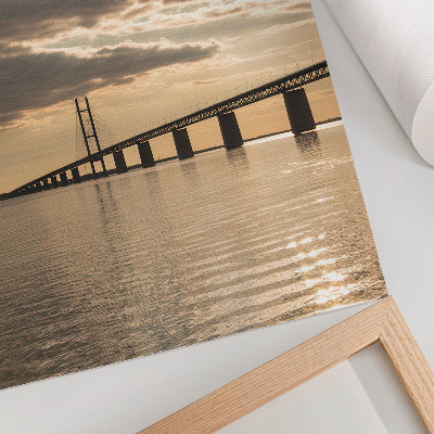 Poster A bridge over the water in the light of the setting sun