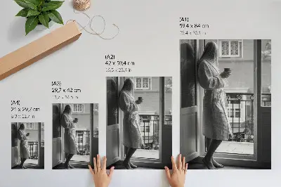 Premium wall art person at the window with a cup of coffee for a peaceful atmosphere