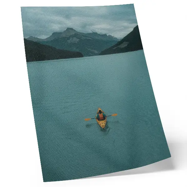Premium wall art featuring a peaceful turquoise lake with a kayaker and mountain landscape