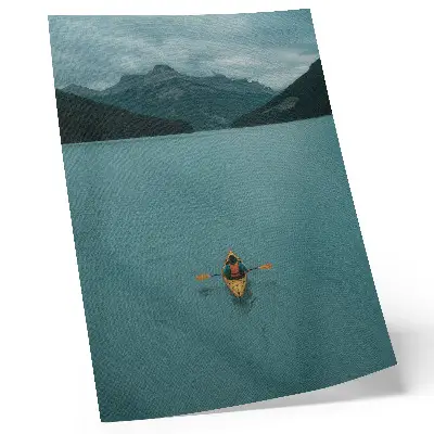 Premium wall art featuring a peaceful turquoise lake with a kayaker and mountain landscape