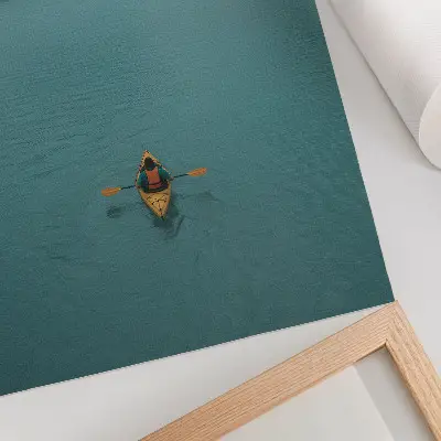 Premium wall art featuring a peaceful turquoise lake with a kayaker and mountain landscape