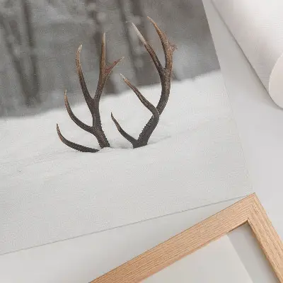 Premium wall art winter landscape featuring antlers in the snow