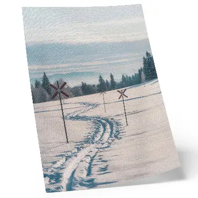 Poster winter landscape with ski tracks, mountains, trees, and sky