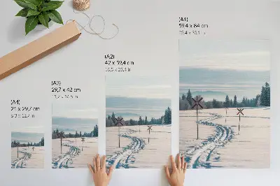 Poster winter landscape with ski tracks, mountains, trees, and sky