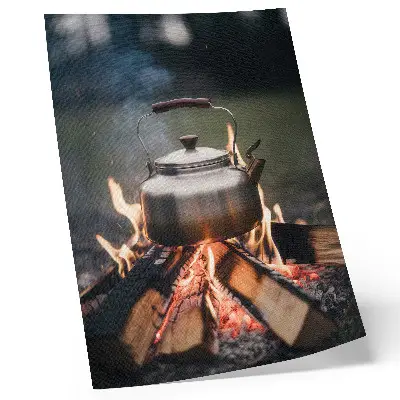 Art print featuring a metallic kettle with wood flames and nature imagery