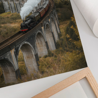 Premium wall art A train on a bridge among green hills