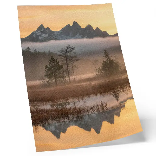 Art print featuring mountains, trees, and fog over calm reflective water