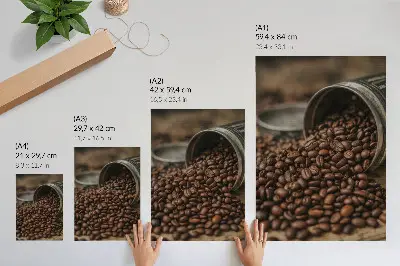 Premium wall art coffee beans in a scattered composition from a metal can