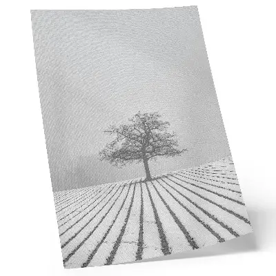 Poster minimalist winter landscape with a tree in the snow