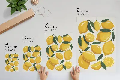 Poster golden lemons with green leaves on a bright background