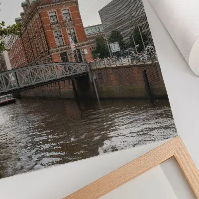 Art print historic building with a brick facade featuring a river bridge and turret
