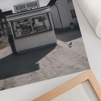 Art print featuring bright wooden buildings in an idyllic kiosk setting