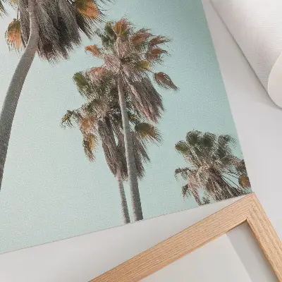 Poster palm trees against a delicate blue sky