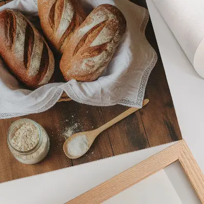 Poster bread basket with flour and a scale on a wooden surface