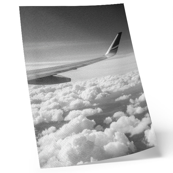Decorative poster Airplane wing above the clouds black and white style