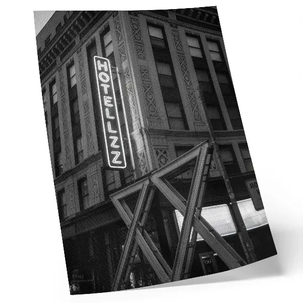 Black and white architectural wall art with neon hotel lights