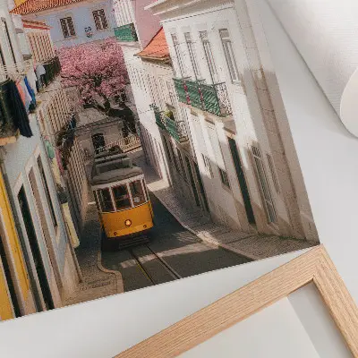 Poster a street with a tram, pastel tenement houses, and flowers