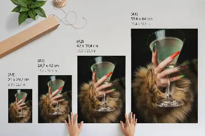 Glass wall art featuring a hand with colorful nails