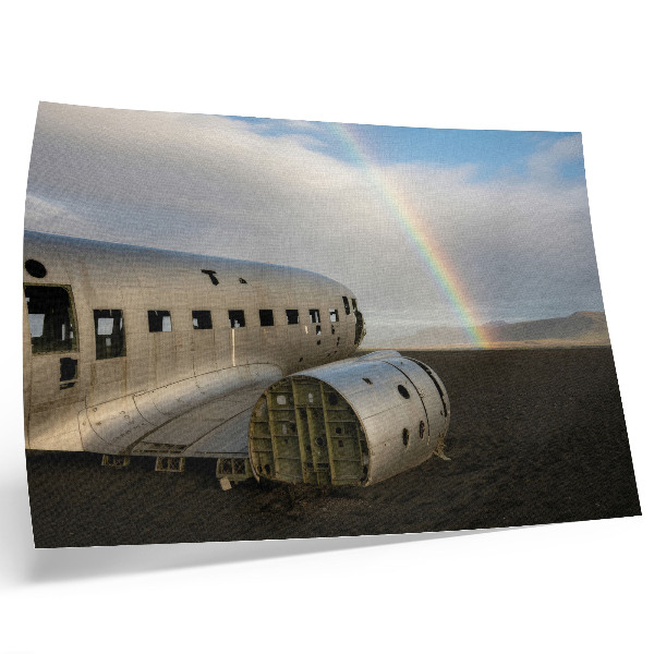 Decorative canvas print A metal plane wreck with a rainbow in the background.