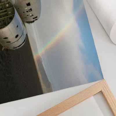 Decorative canvas print featuring a metal plane wreck with a rainbow in the background
