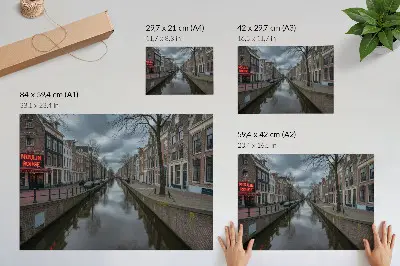 Poster canal with gentle architecture under an atmospheric sky