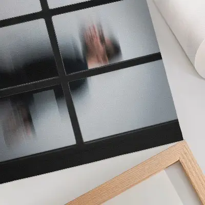 Decorative canvas print black silhouette behind a glass frame in gray minimalism