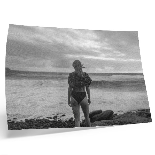 Photo canvas Black and white scene with a figure by the water