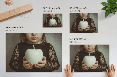Decorative canvas print Girl with white fruit mysterious atmosphere