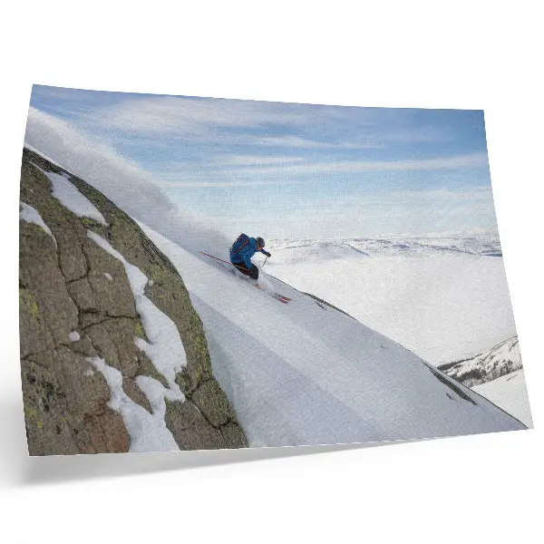 Photo canvas skier on white peaks against a blue sky