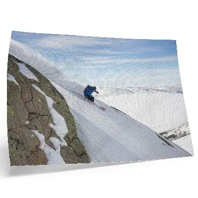 Photo canvas skier on white peaks against a blue sky