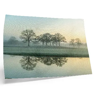 Photo canvas calm water surface with reflections of trees in soft fog
