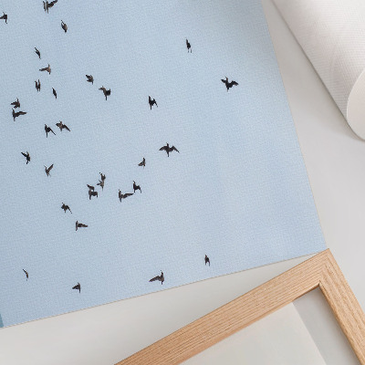 Decorative canvas print A flock of birds over the blue sea