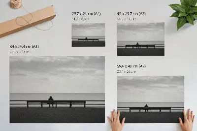 Decorative canvas print person on a bench by the sea in gray harmony