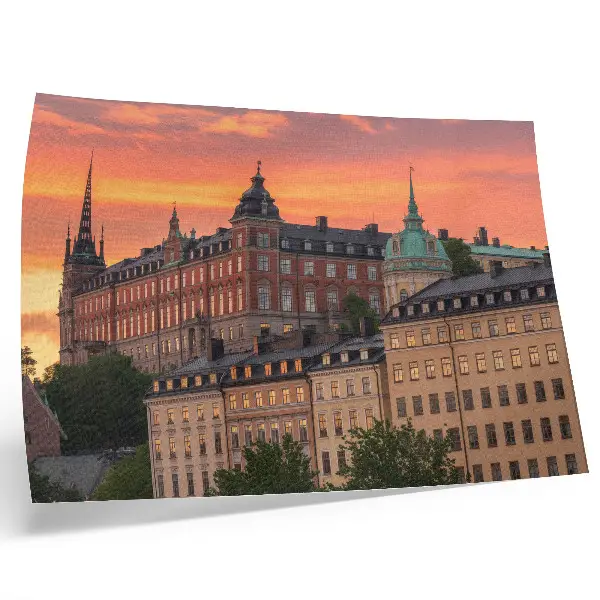 Decorative canvas print featuring a sunset over charming historical buildings