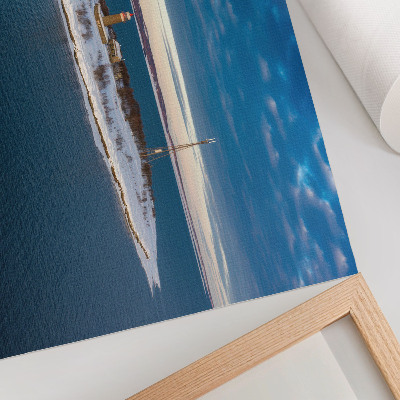 Photo canvas Winter island with a lighthouse and blue sea