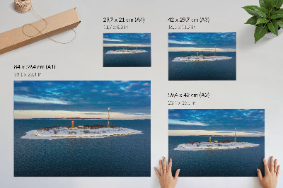 Photo canvas Winter island with a lighthouse and blue sea