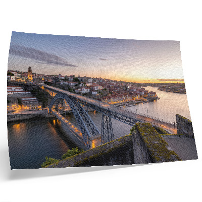 Decorative canvas print The bridge against the backdrop of the setting sun and the city