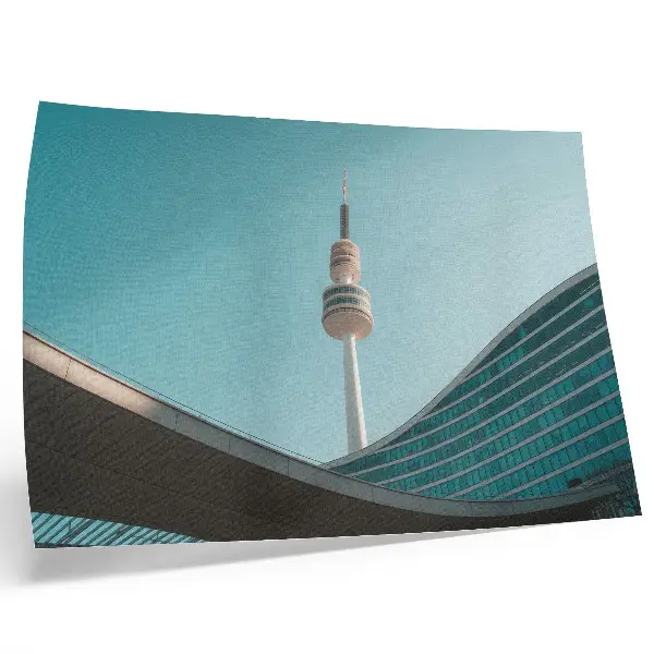 Decorative canvas print featuring a modern city tower against a blue sky
