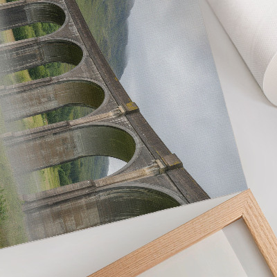 Decorative canvas print A majestic arch bridge among greenery