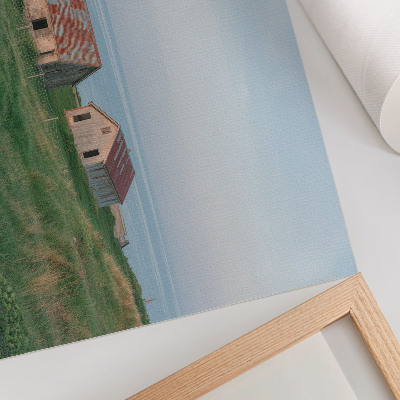 Poster Rustic buildings green meadows sea