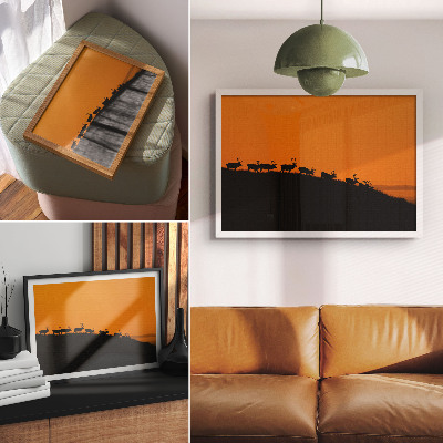Photo canvas Silhouettes of deer on a hill with an orange background