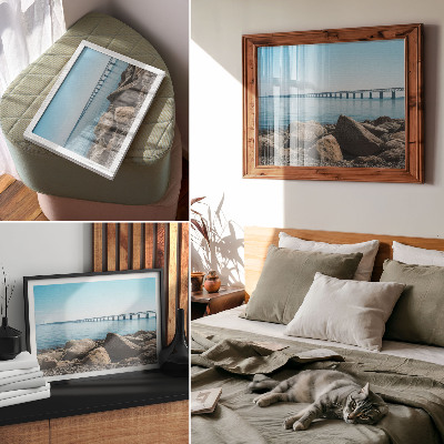 Decorative canvas print Bridge over blue water stones on the shore