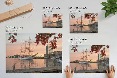 Decorative canvas print A sailing ship at sunset, a peaceful panorama of the city